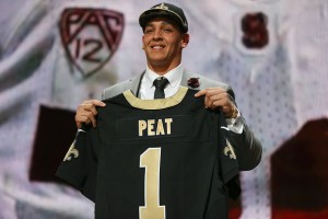 CHICAGO, IL - APRIL 30:  Andrus Peat of the Stanford Cardinal football team holds up a jersey after being picked #13 by the New Orleans Saints during the first round of the 2015 NFL Draft at the Auditorium Theatre of Roosevelt University on April 30, 2015 in Chicago, Illinois.  (Photo by Jonathan Daniel/Getty Images)